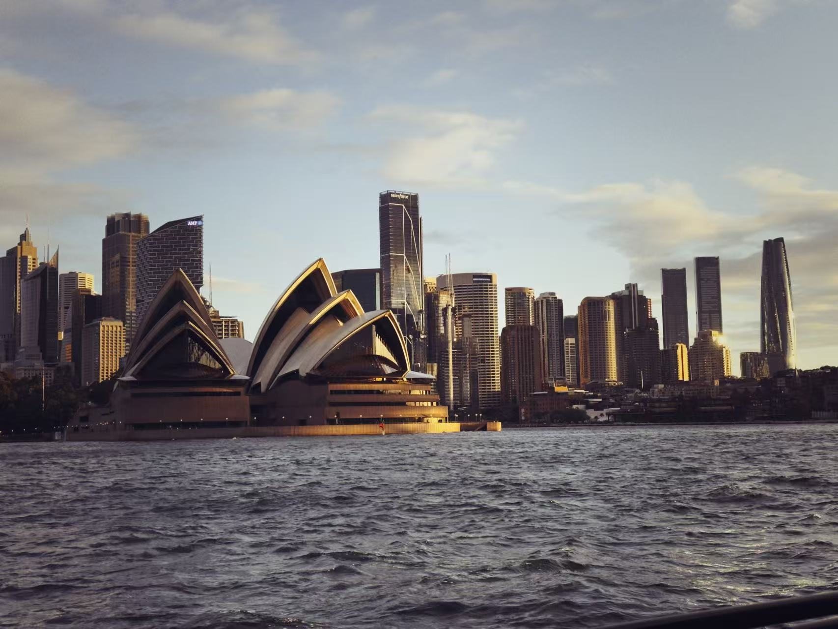 Sydney Opera House and skyline at sunset