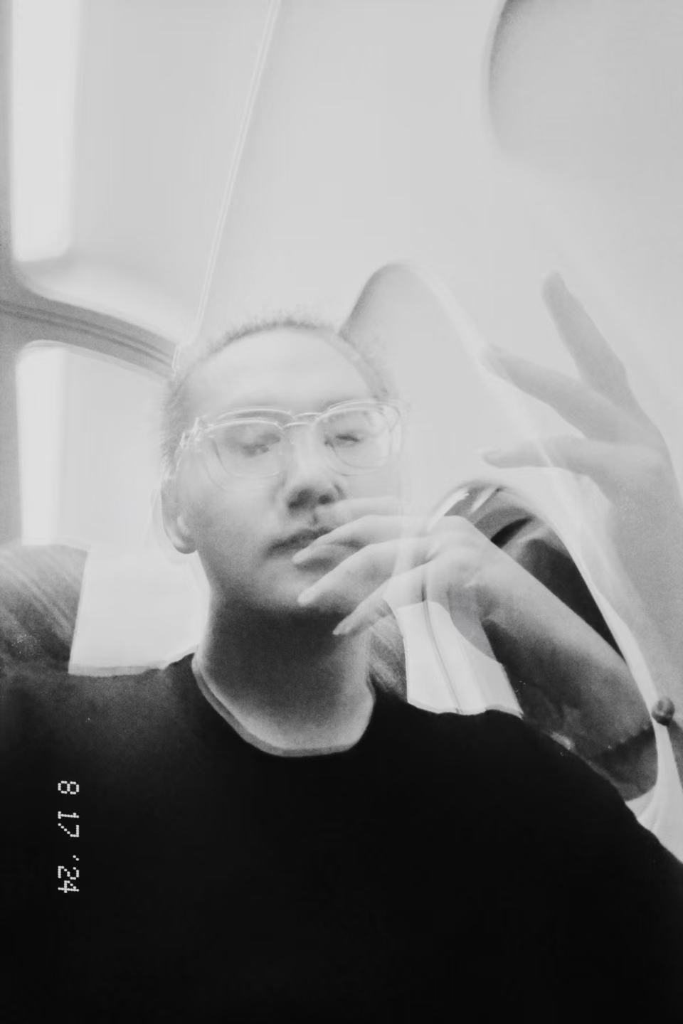 Black-and-white double exposure portrait of Jesse Liu