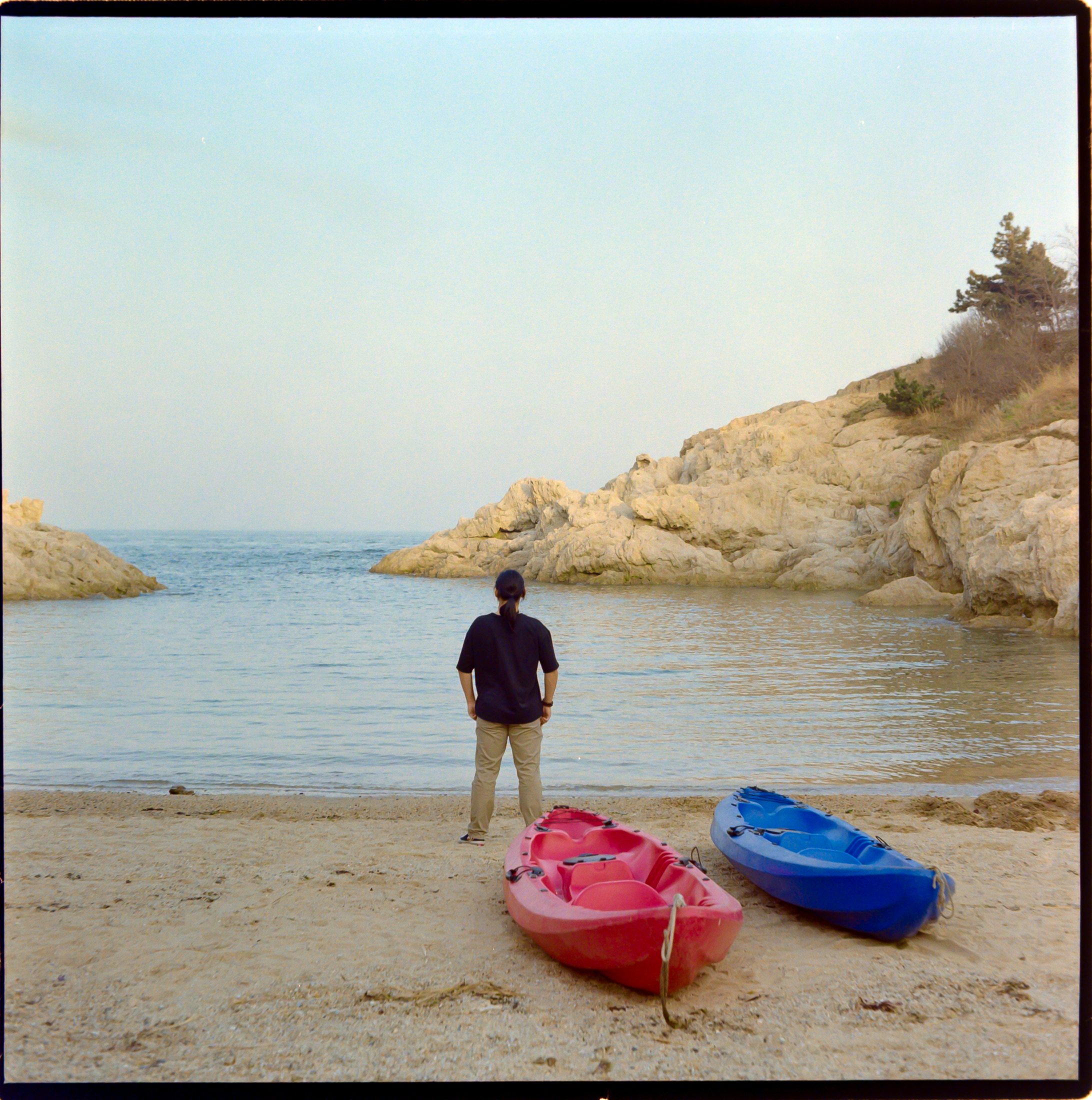 Kayaks on a quiet beach