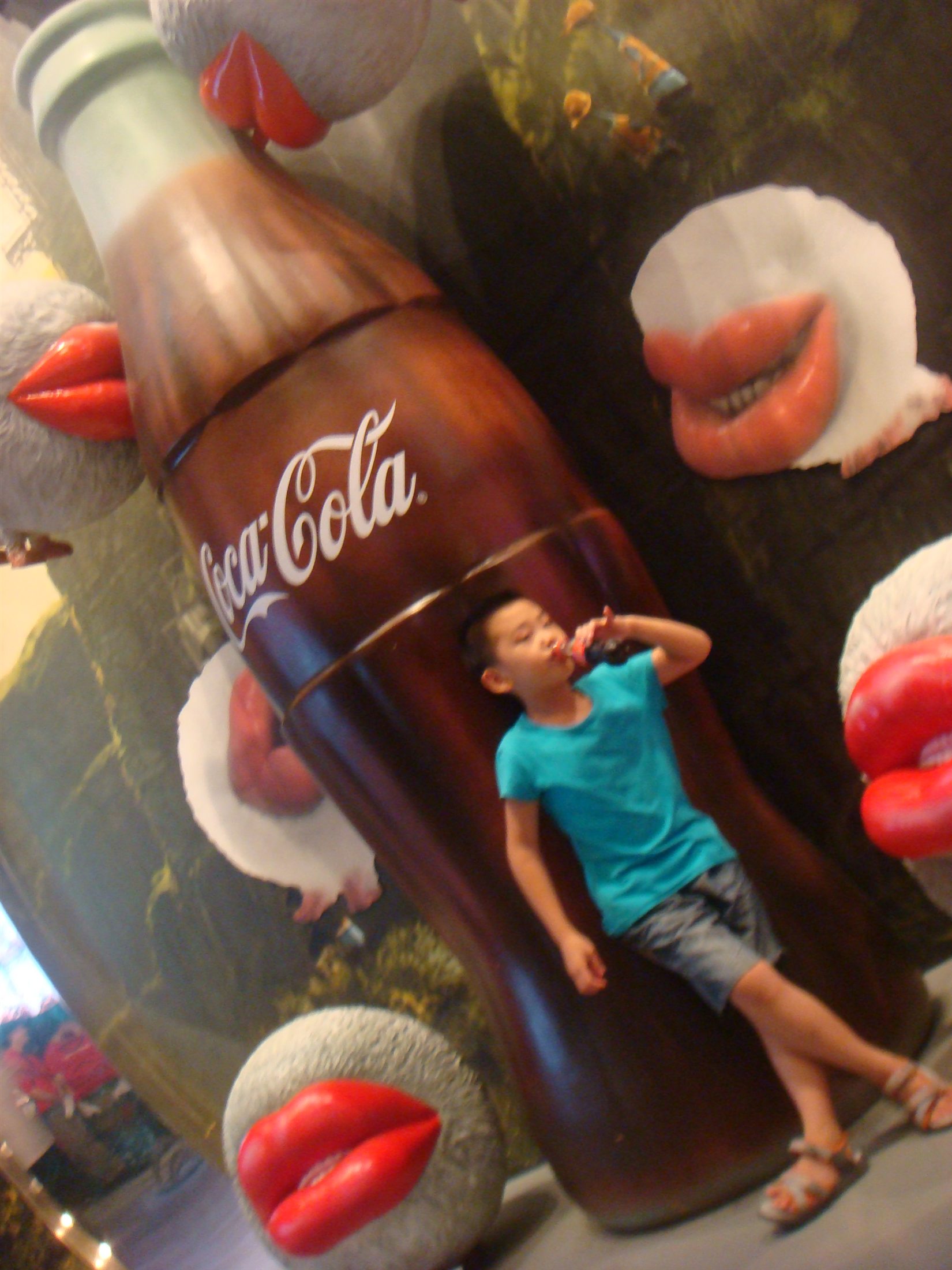 Jesse Liu as a child beside a Coca-Cola display